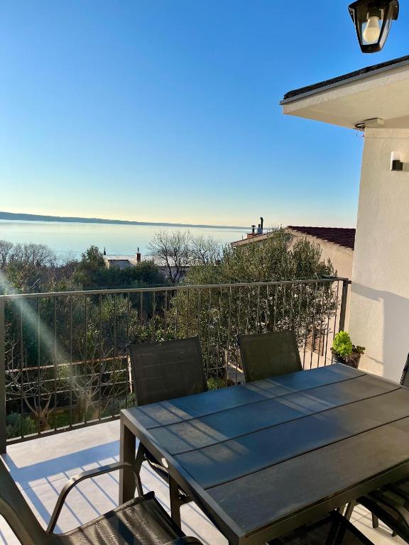 Terrace with dining table overlooking the Adriatic Sea